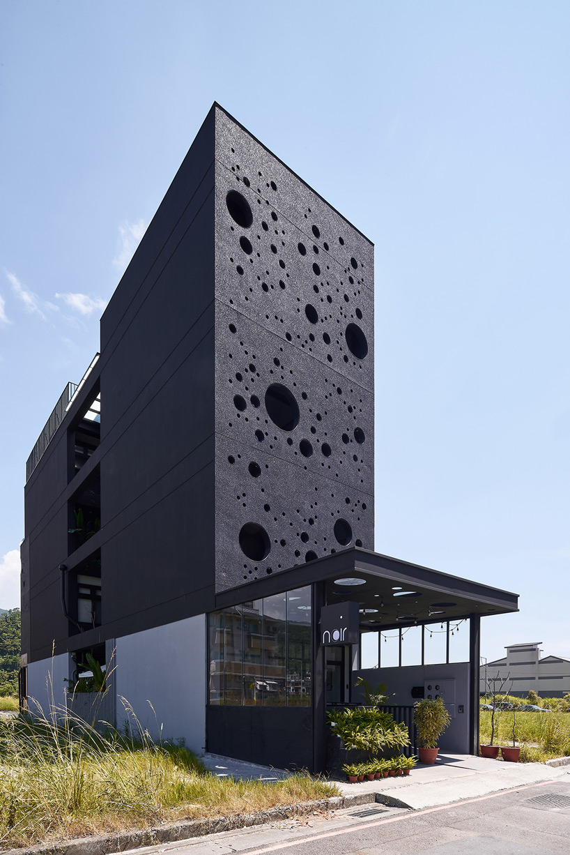 emerge architects' sea foam-inspired guesthouse in taiwan attracts passersby at night - 1