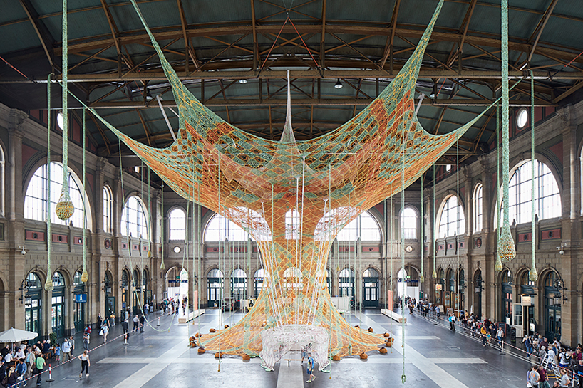 ernesto neto hand-knots monumental tree inside zurich's central station GaiaMotherTree designboom