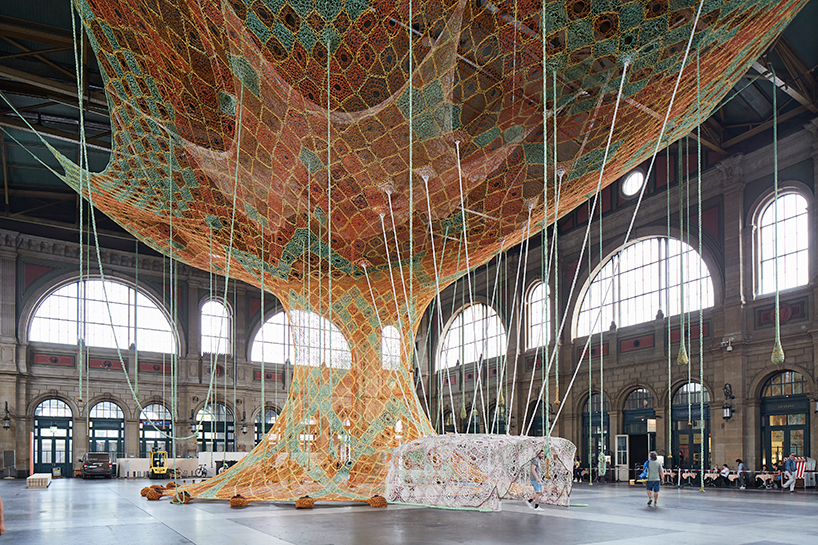 ernesto neto hand-knots monumental tree inside zurich's central station GaiaMotherTree designboom
