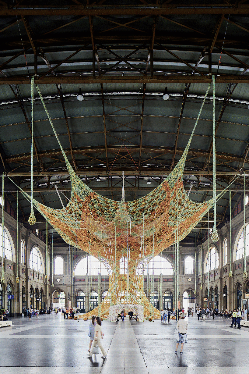 ernesto neto hand-knots monumental tree inside zurich's central station GaiaMotherTree designboom
