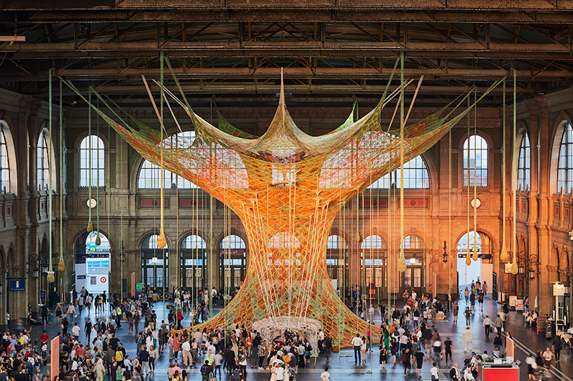 ernesto neto hand-knots monumental tree inside zurich's central station GaiaMotherTree designboom