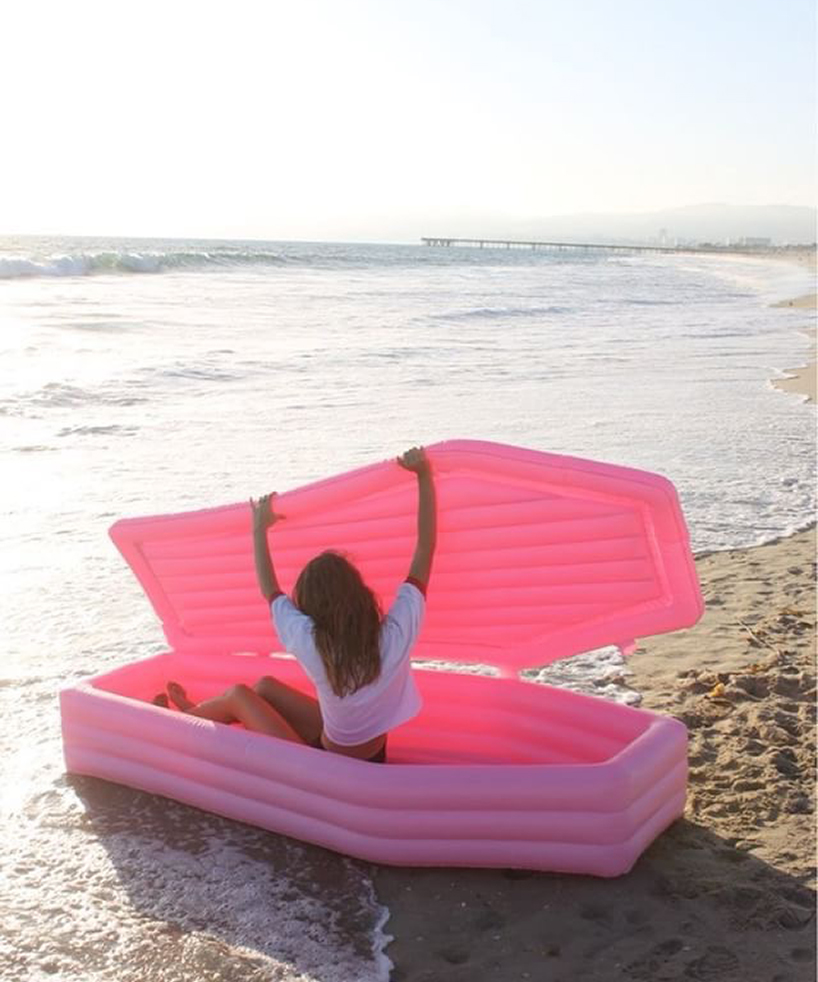 bury yourself this summer in this pink coffin float by pom pom designboom