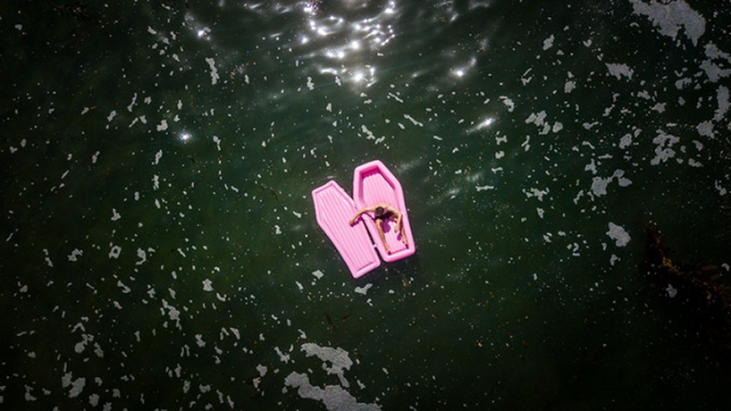 bury yourself this summer in this pink coffin float by pom pom designboom