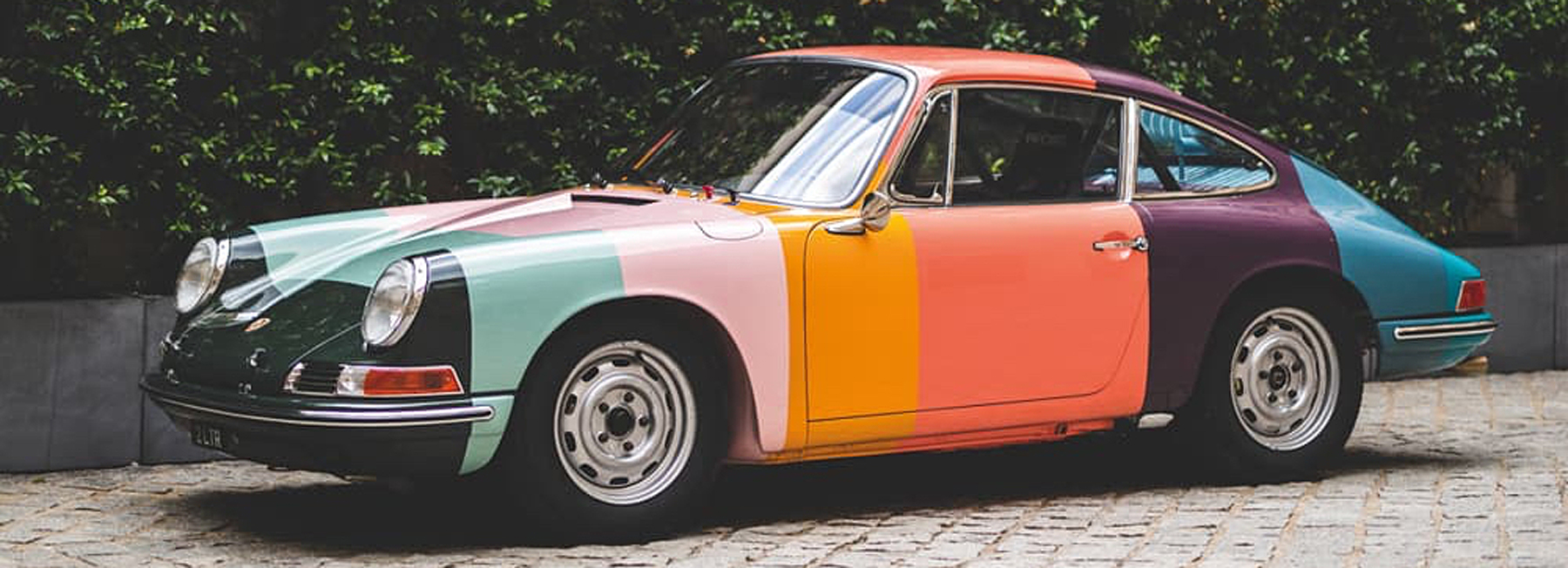 this porsche 1965 911 racer has been made over in paul smith's iconic stripes