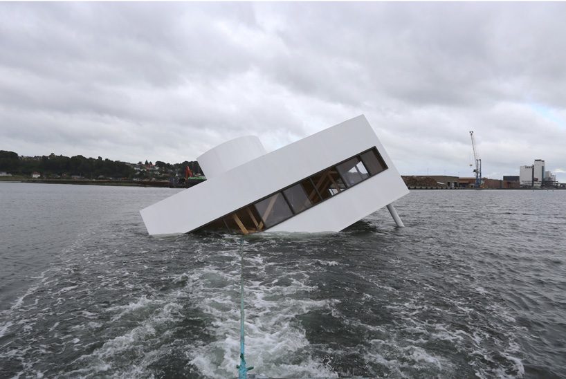 le corbusier's villa savoye floating in a danish fjord is a comment on the ‘sinking’ of modernity