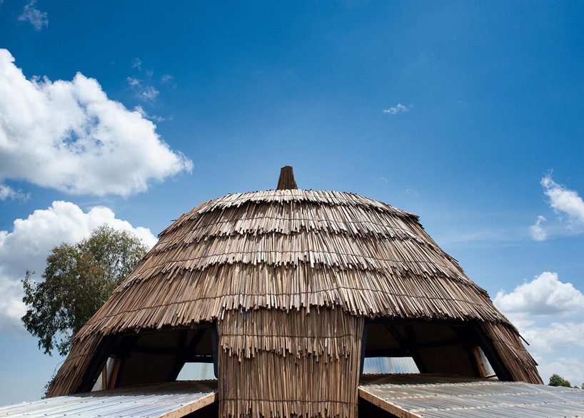 studio FH uses eucalyptus poles and rubble stone to build the batwa settlement in uganda