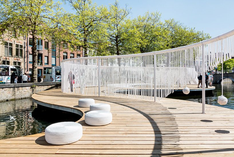 pavilion with playful swings and hammocks floats in a bruges canal, by OBBA and dertien 12