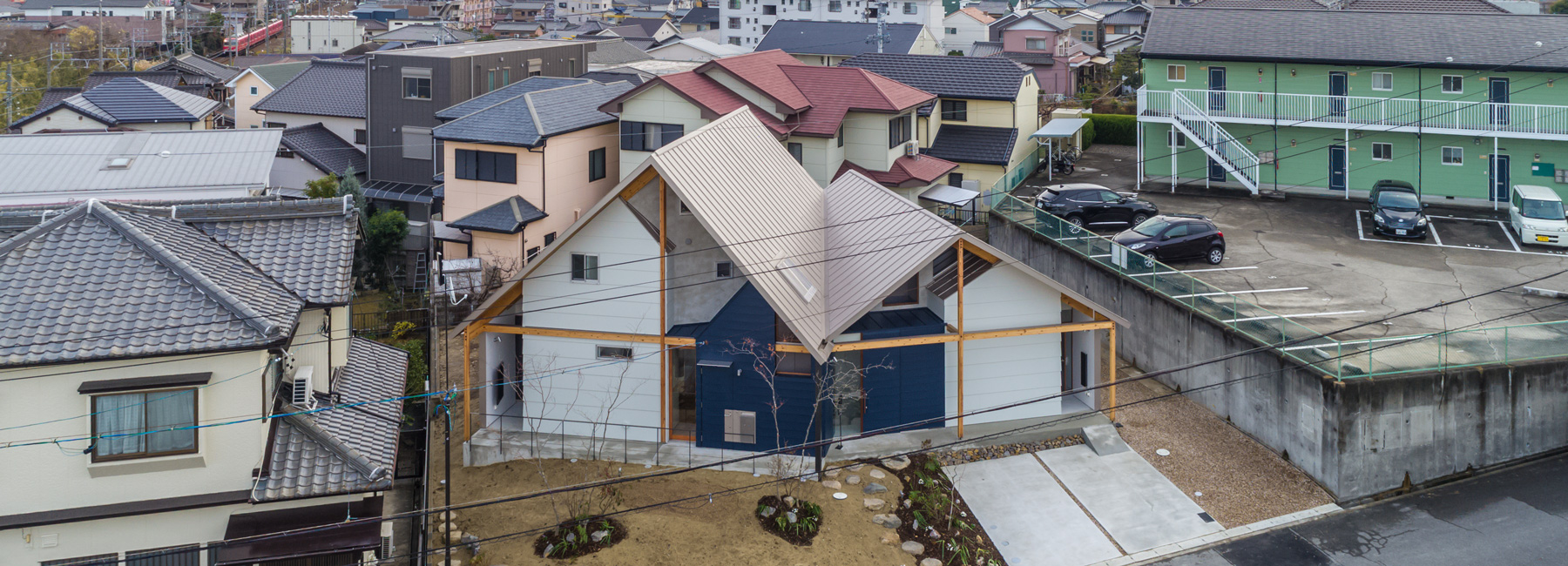 maki yoshimura frames two-volume house in japan with timber truss skeleton
