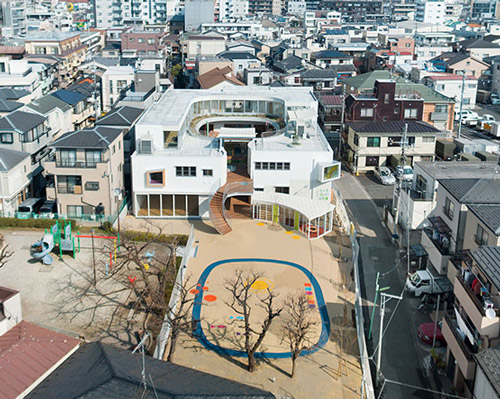 mamm design's kindergarten in tokyo concentrates around a lush green courtyard