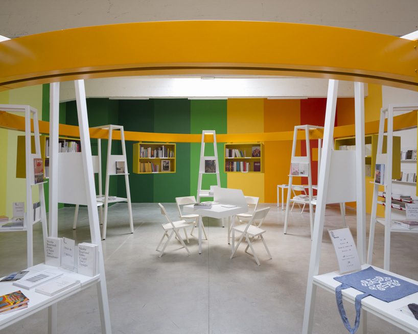 matali crasset suspends books in a circular monorail  for le consortium's bookstore in dijon designboom