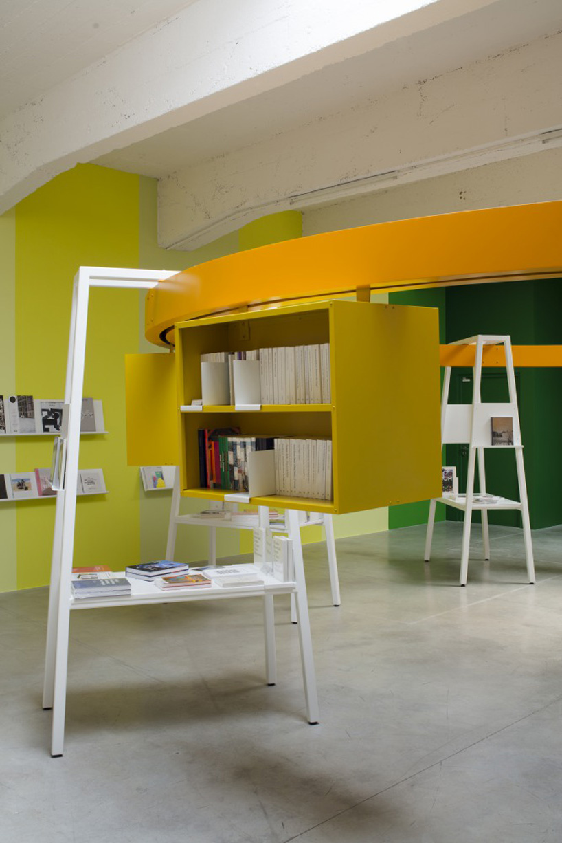 matali crasset suspends books in a circular monorail  for le consortium's bookstore in dijon designboom