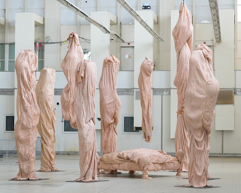 bart hess manipulates pink latex to resemble wrinkled human skin in grotto installation