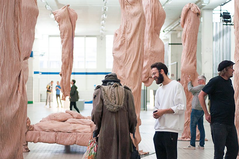 bart hess manipulates pink latex to resemble wrinkled human skin in grotto installation