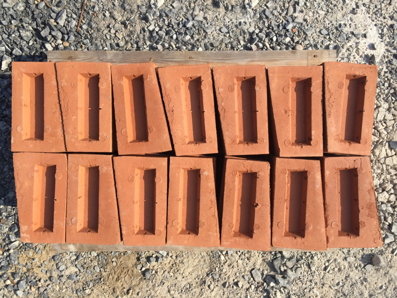 this undulating brick façade imitates the movement of draped fabric