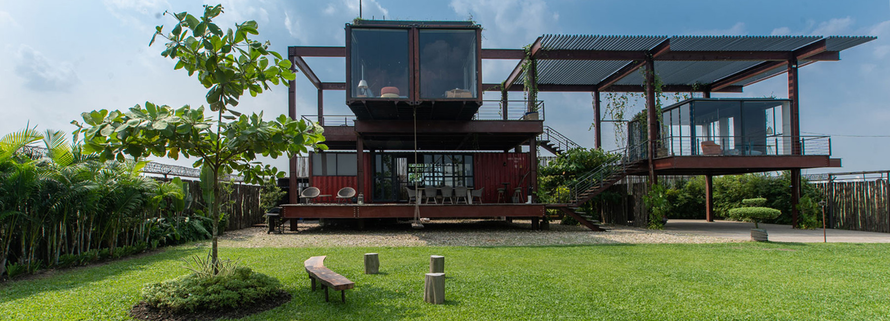 river & rain combines recycled shipping containers into three-story residence in dhaka