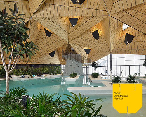 enota architects transforms slovenia wellness center with a sculptural roof structure