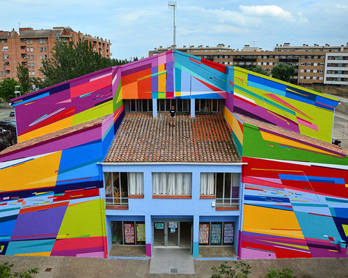 an elementary school façade in spain becomes a radical representation of electronic music