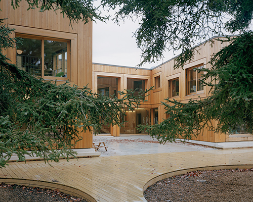 lacroix chessex architectes envelops the landscape with nursery in switzerland