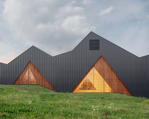 community hall by LOCALARCHITECTURE responds to switzerland's undulating topography