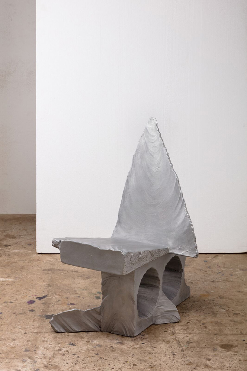 max lamb carves ‘prehistoric' objects from polystyrene then coats them with aluminum paint