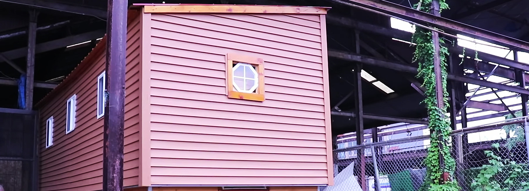 this tiny house on wheels has a raising roof that reveals a second floor