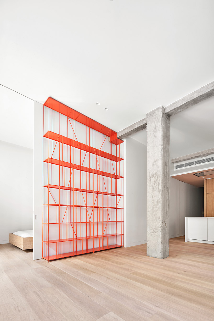 lucas y hernández-gil completes a madrid apartment with a coral-painted metal shelf designboom