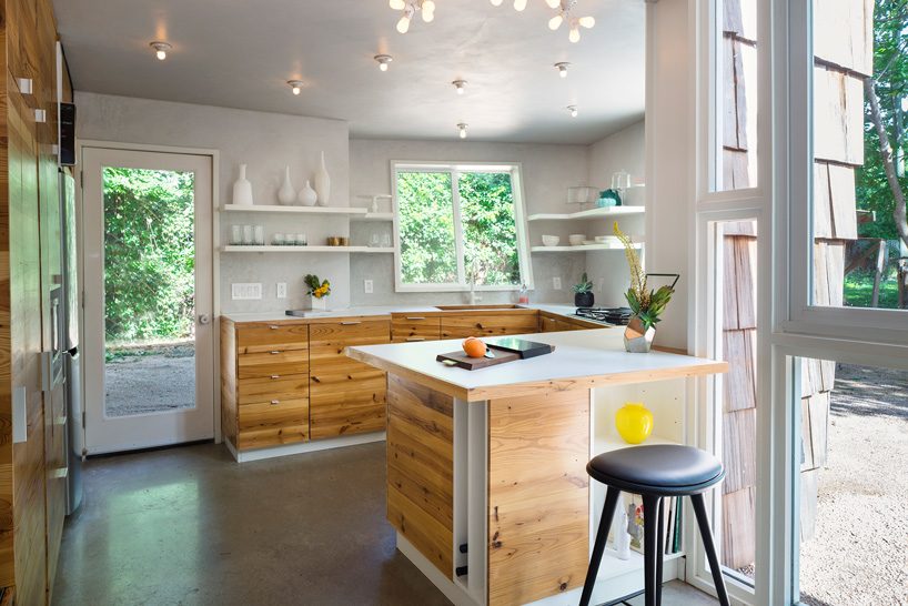 studio 512 clads the angled walls of this texas guesthouse in reclaimed cedar shakes - 5