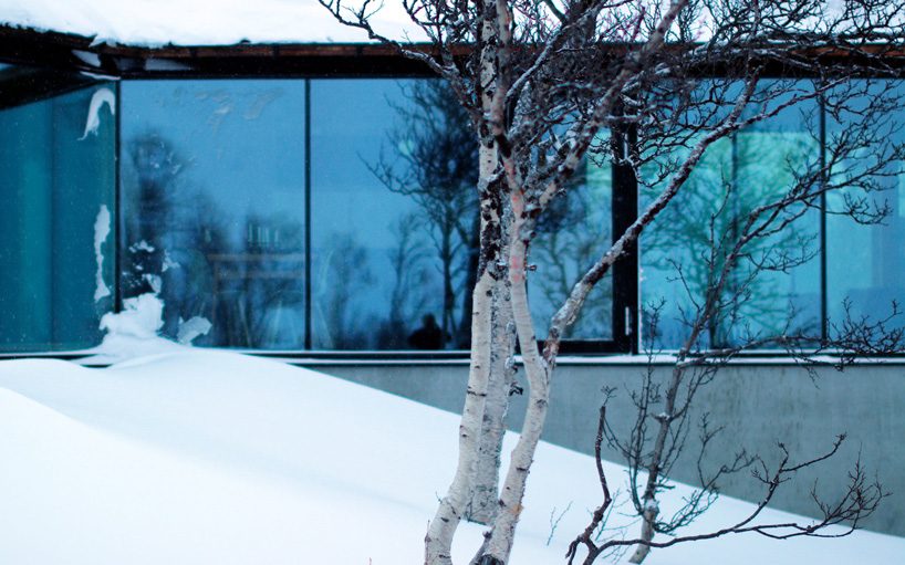 vardehaugen's nerskogen cabin in norway is defined by three separate fireplaces