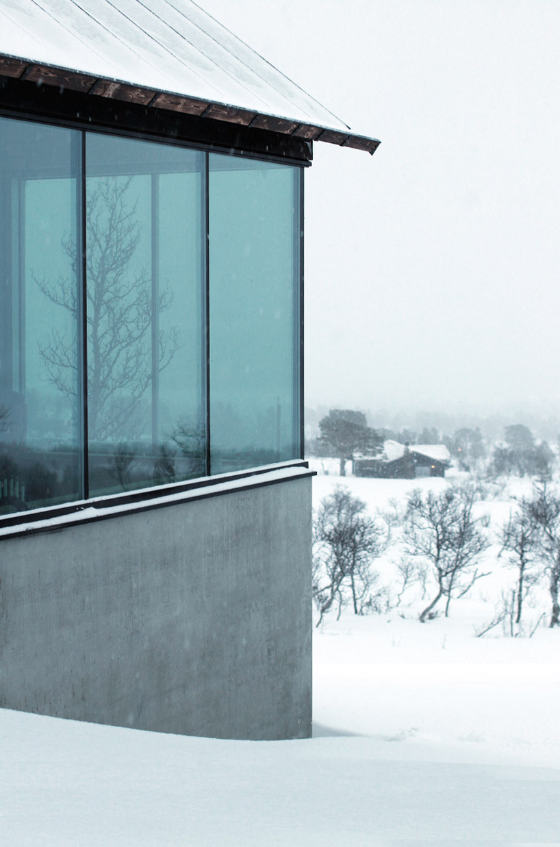 vardehaugen's nerskogen cabin in norway is defined by three separate fireplaces