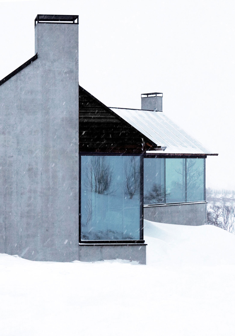 vardehaugen's nerskogen cabin in norway is defined by three separate fireplaces