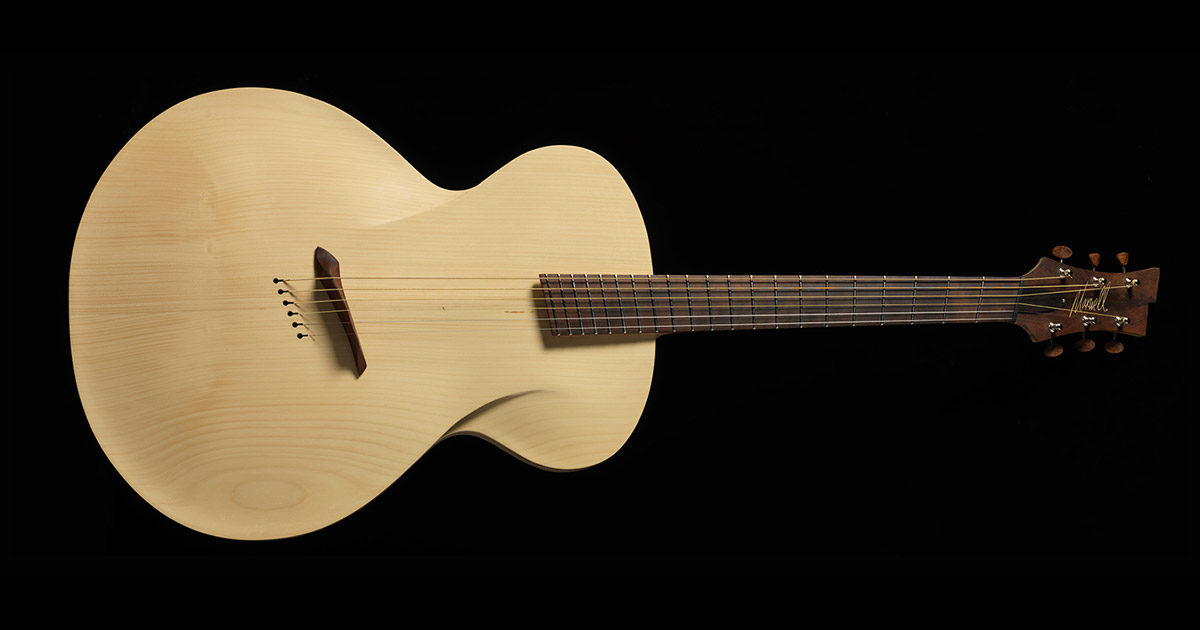 maxwell custom carefully crafts the 'infinitum' acoustic guitar