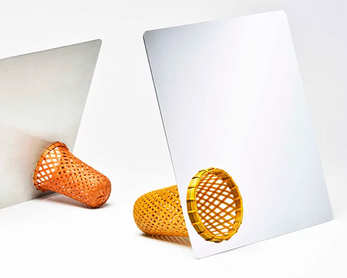 gridesign studio's new table mirror stands on a weaved bamboo bin