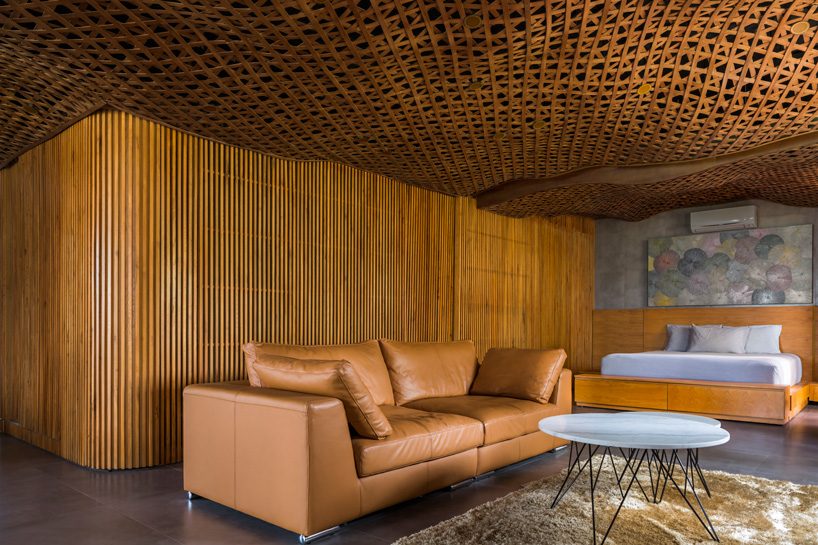 CTA tops vietnam apartment with 'cloud' of interlaced wood on its ceiling