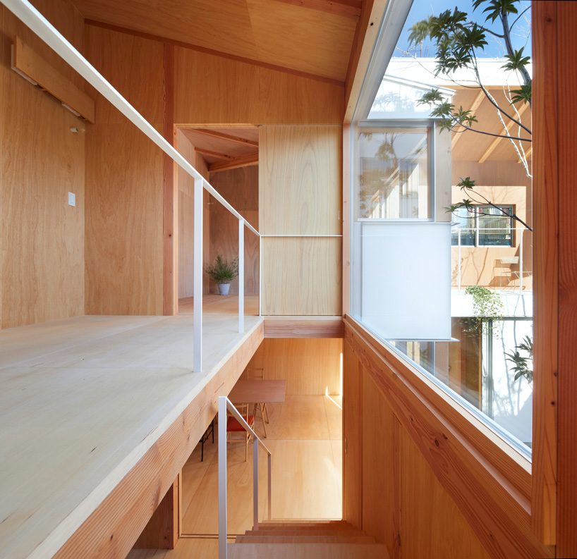 tomohiro hata blurs boundaries between interiors and courtyard of the loop terrace house
