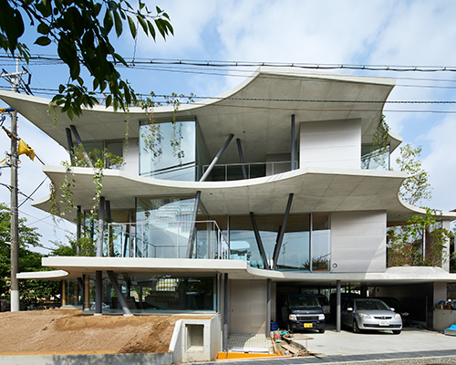 tomohiro hata constructs the 'ground house' in response to the density of osaka