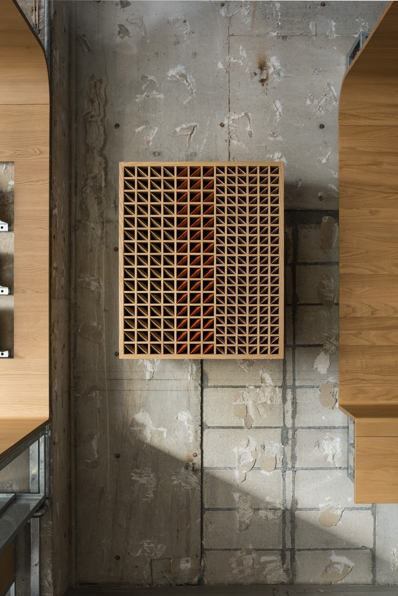 torafu architects uses curved wooden framework to define space of tokyo aesop interior