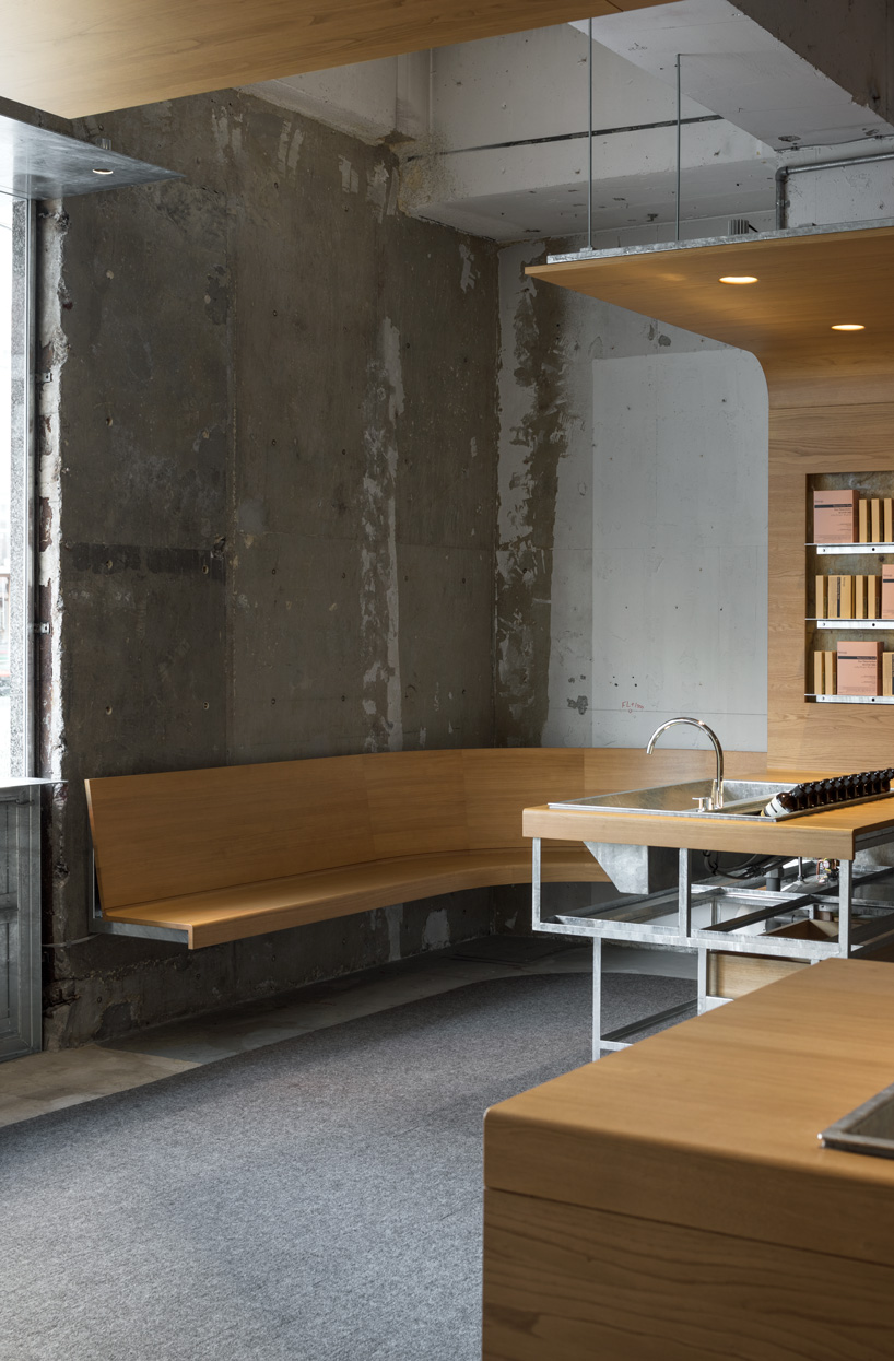 torafu architects uses curved wooden framework to define space of tokyo aesop interior
