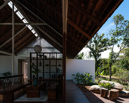 YT house by studio rear connects indoor spaces with the nature of vietnam
