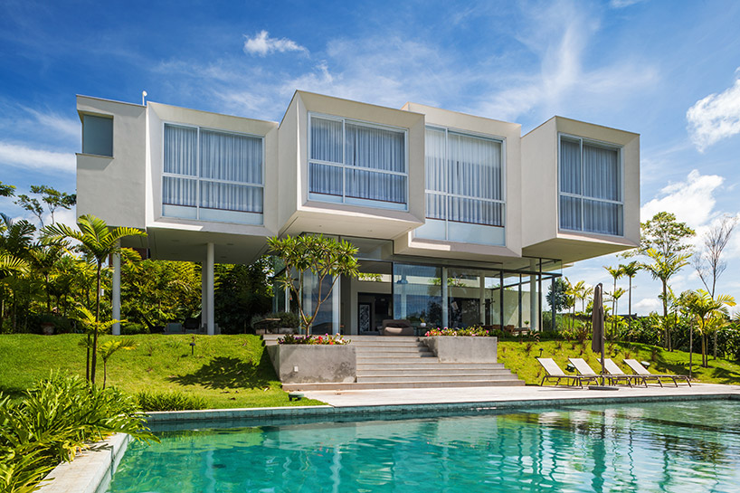 FGMF arquitetos cantilevers white volumes in sao paulo's neblina house designboom