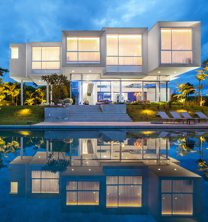 FGMF arquitetos cantilevers white volumes in sao paulo's neblina house designboom