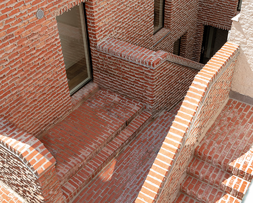 dmvA's addition to a historic site in belgium features brickwork with 'weeping mortar'