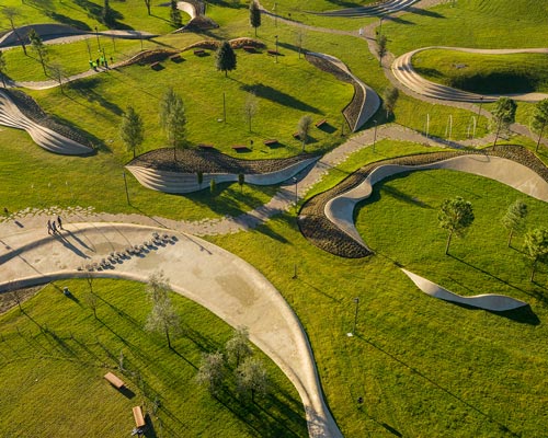 enota uses organically designed urban elements to delineate waterfront park in slovenia