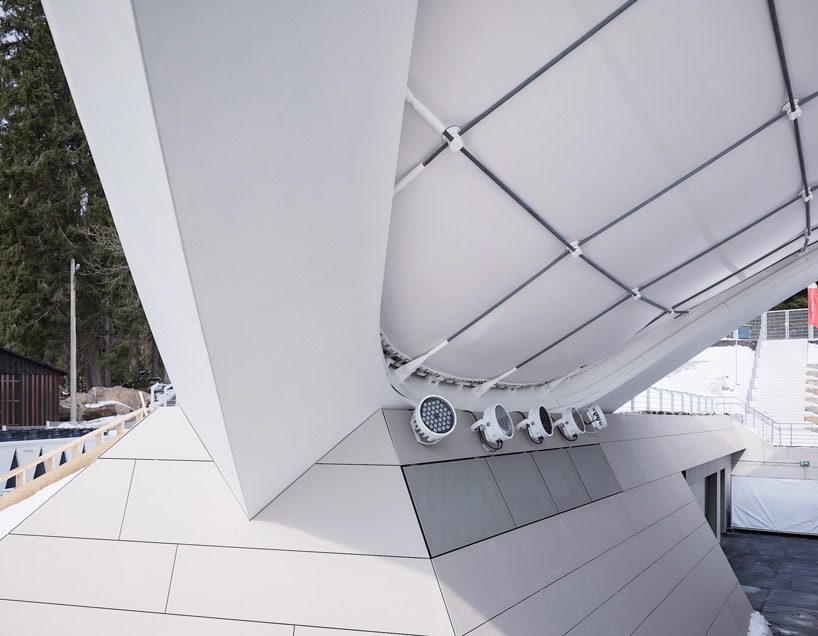 graft constructs dramatic curved roof over feuerstein arena in germany