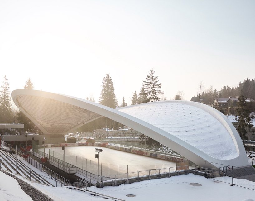 graft constructs dramatic curved roof over feuerstein arena in germany