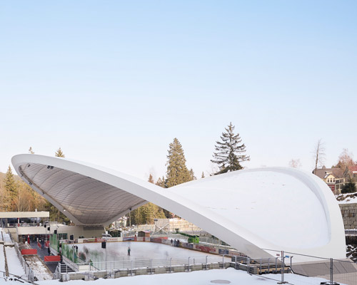 graft constructs dramatic curved roof over feuerstein arena in germany