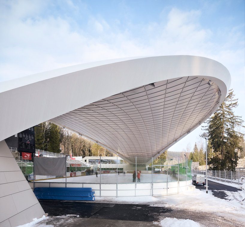 graft constructs dramatic curved roof over feuerstein arena in germany