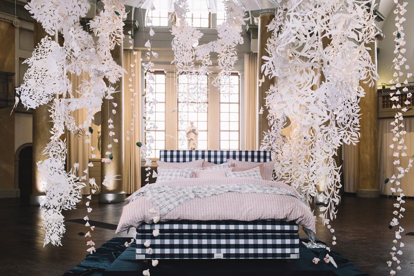 hästens unveils linen collection by lars nilsson under a sky of paper cut  flowers