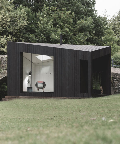 koto designs triangular prefabricated cabins clad with charred wood