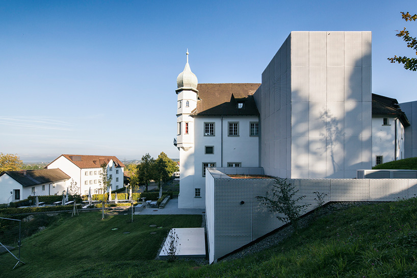 marte marte architects covers hofen castle extension in austria with translucent aluminum mesh designboom