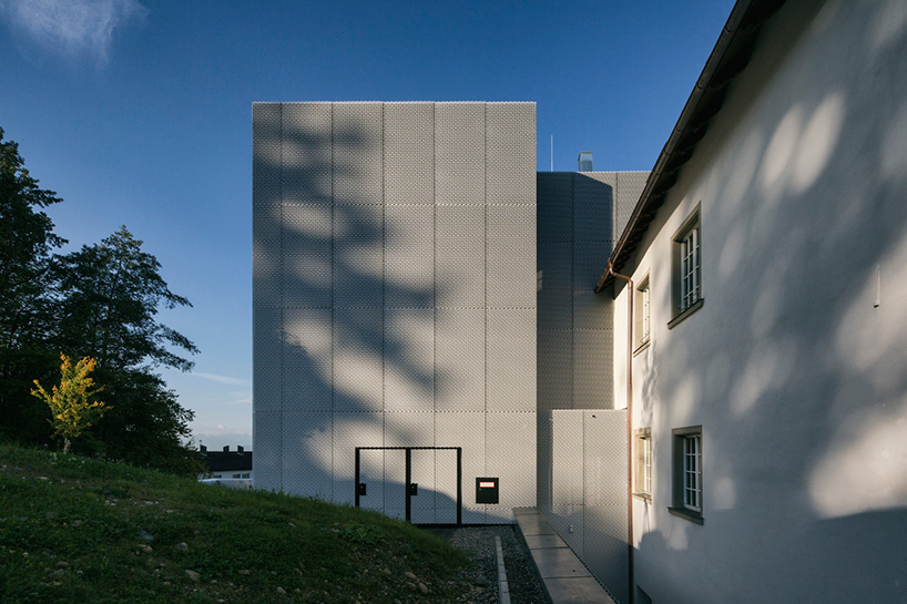 marte marte architects covers hofen castle extension in austria with translucent aluminum mesh designboom